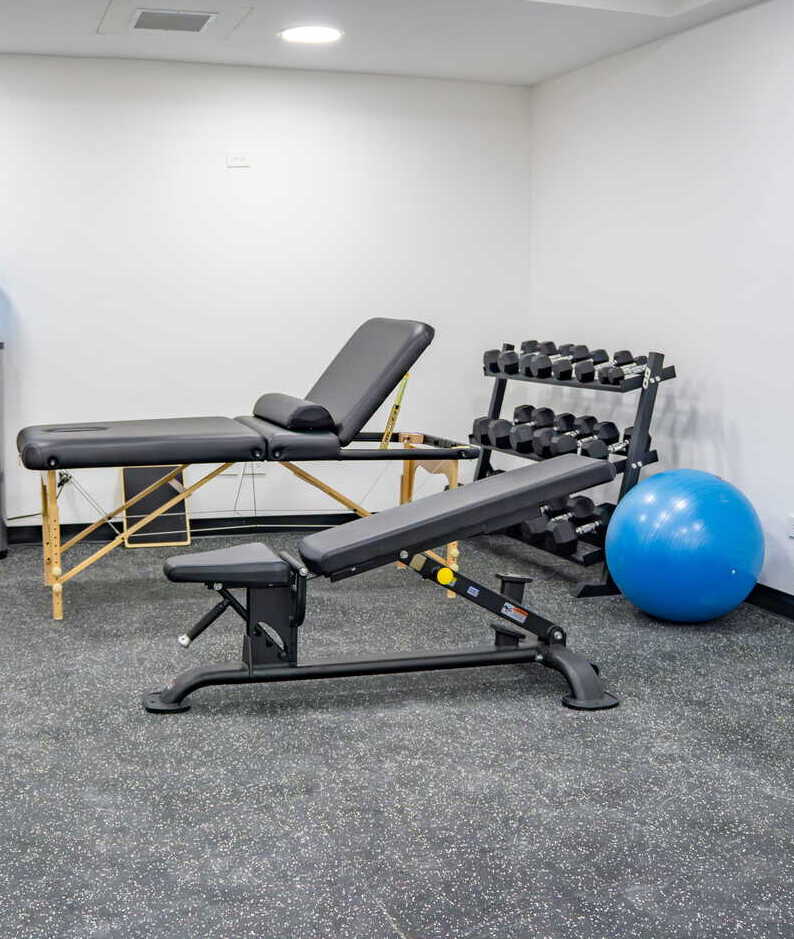 Physical therapy treatment room and equipment at Maple Wellness Center